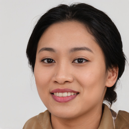 Joyful asian young-adult female with long  brown hair and brown eyes