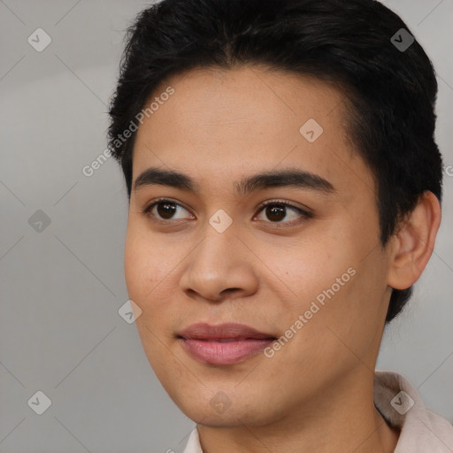 Joyful asian young-adult male with short  black hair and brown eyes