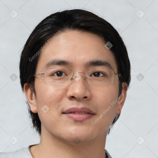 Joyful asian young-adult male with short  brown hair and brown eyes