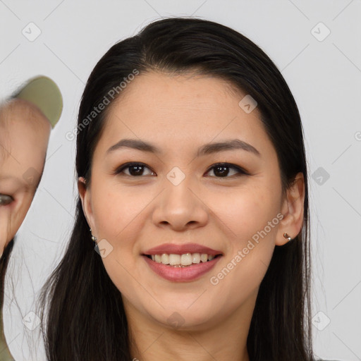 Joyful asian young-adult female with long  brown hair and brown eyes