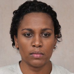 Neutral black young-adult female with short  brown hair and brown eyes