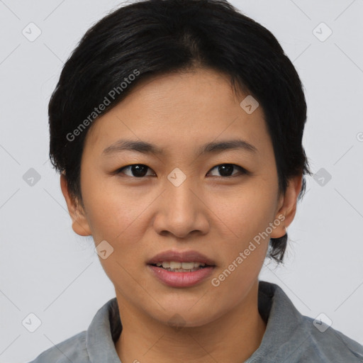 Joyful asian young-adult female with short  black hair and brown eyes