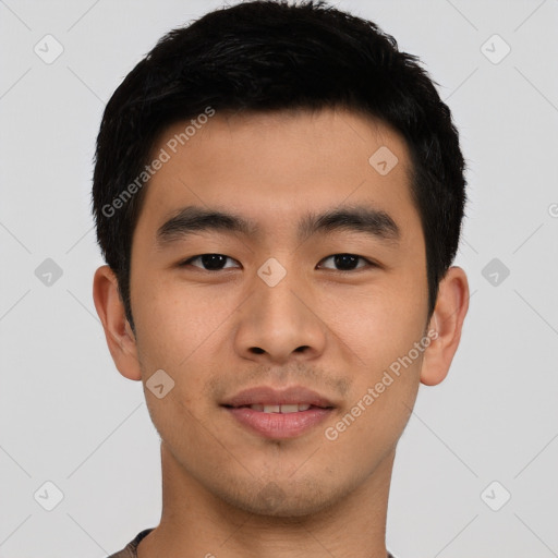 Joyful asian young-adult male with short  black hair and brown eyes