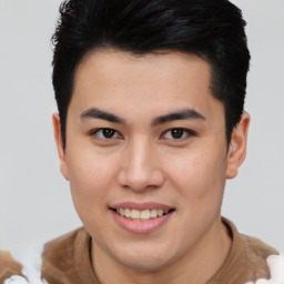 Joyful asian young-adult male with short  brown hair and brown eyes