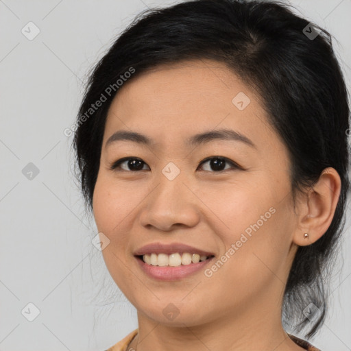 Joyful asian young-adult female with medium  brown hair and brown eyes