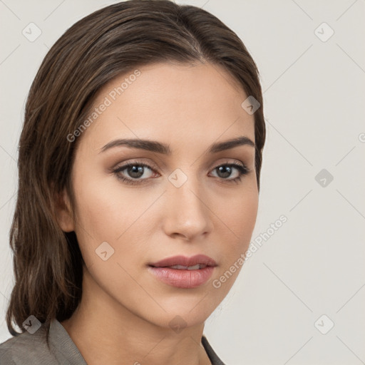 Neutral white young-adult female with long  brown hair and brown eyes