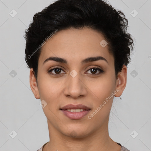 Joyful latino young-adult female with short  black hair and brown eyes