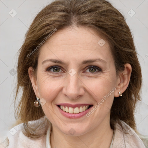 Joyful white adult female with medium  brown hair and grey eyes