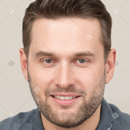 Joyful white adult male with short  brown hair and brown eyes