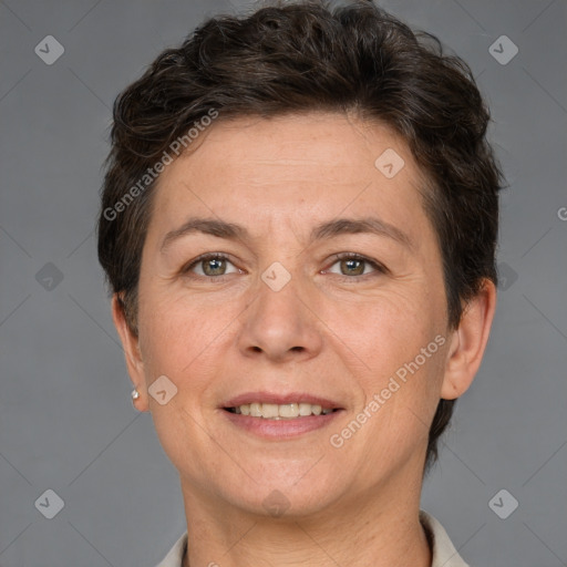 Joyful white adult female with short  brown hair and brown eyes