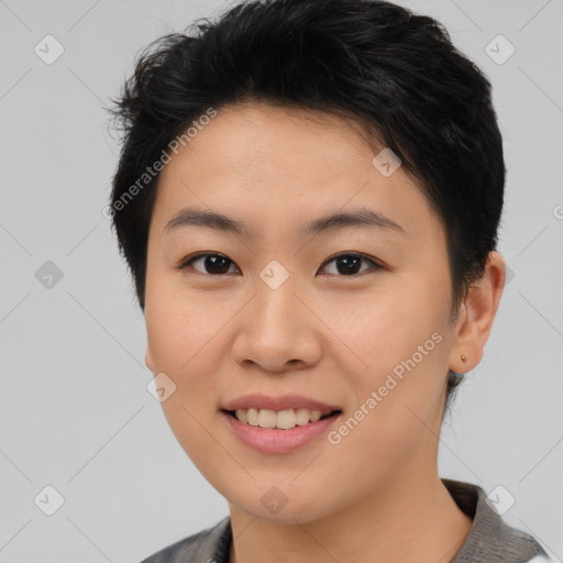 Joyful asian young-adult female with short  brown hair and brown eyes