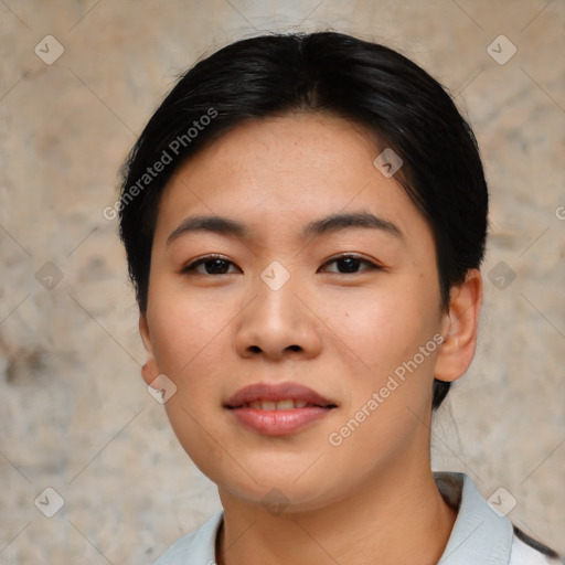 Joyful asian young-adult female with short  black hair and brown eyes