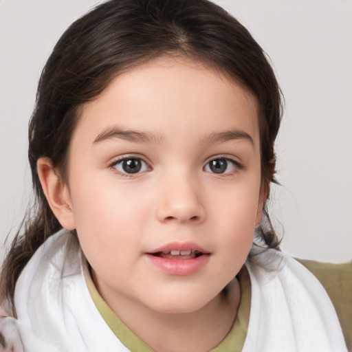 Joyful white child female with medium  brown hair and brown eyes