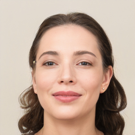 Joyful white young-adult female with medium  brown hair and brown eyes