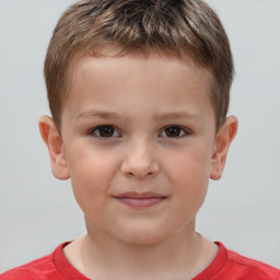 Joyful white child male with short  brown hair and brown eyes