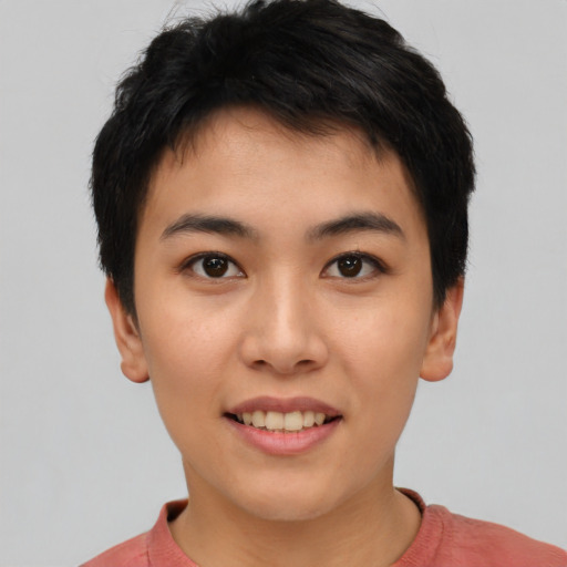 Joyful asian young-adult female with short  black hair and brown eyes