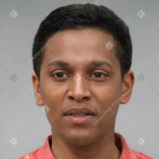 Joyful latino young-adult male with short  brown hair and brown eyes