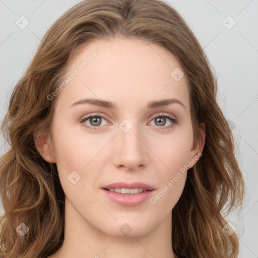 Joyful white young-adult female with long  brown hair and blue eyes