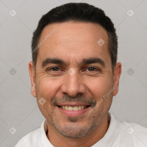 Joyful white adult male with short  black hair and brown eyes