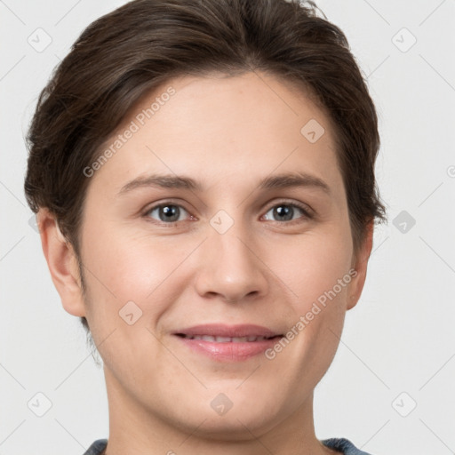 Joyful white young-adult female with short  brown hair and grey eyes