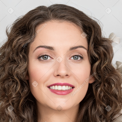 Joyful white young-adult female with long  brown hair and green eyes