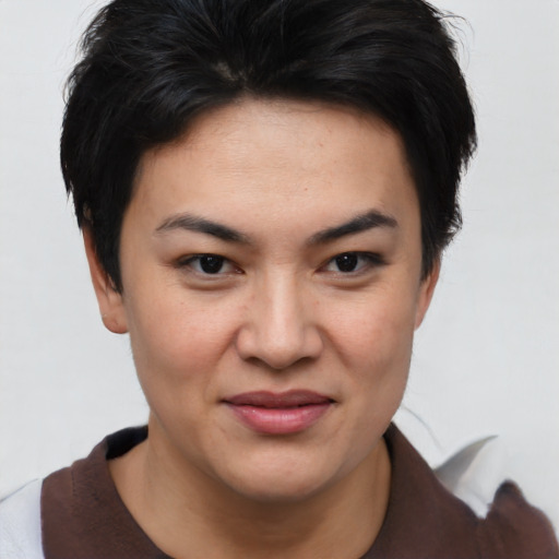 Joyful asian young-adult female with short  brown hair and brown eyes
