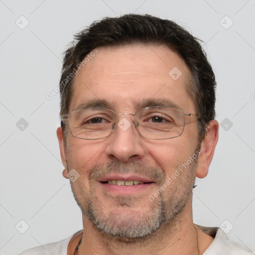 Joyful white adult male with short  brown hair and grey eyes