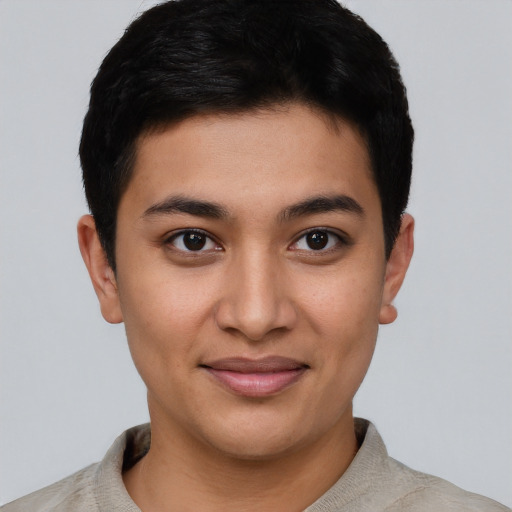 Joyful asian young-adult male with short  brown hair and brown eyes