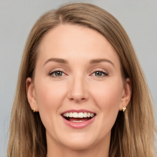 Joyful white young-adult female with long  brown hair and grey eyes