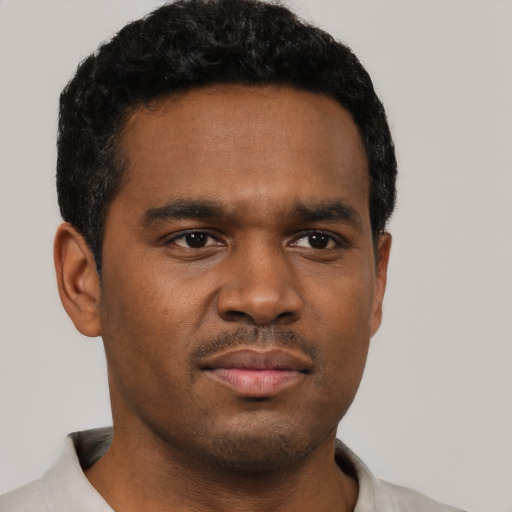 Neutral black young-adult male with short  black hair and brown eyes