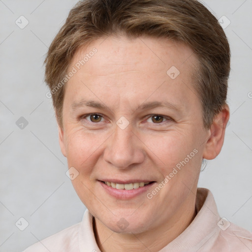 Joyful white adult female with short  brown hair and brown eyes