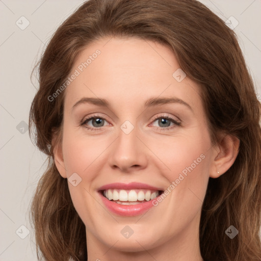 Joyful white young-adult female with long  brown hair and green eyes