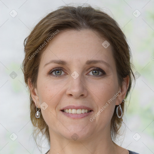 Joyful white adult female with medium  brown hair and grey eyes