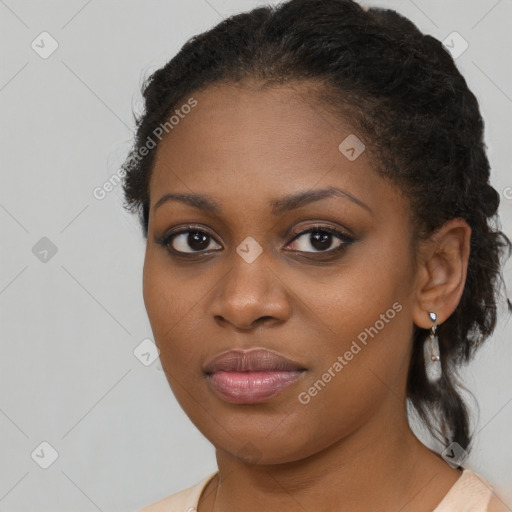 Joyful black young-adult female with medium  brown hair and brown eyes