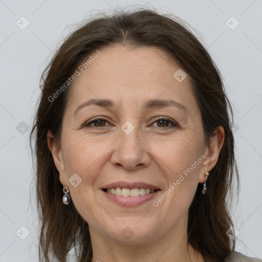 Joyful white adult female with medium  brown hair and grey eyes