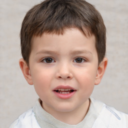 Joyful white child male with short  brown hair and brown eyes