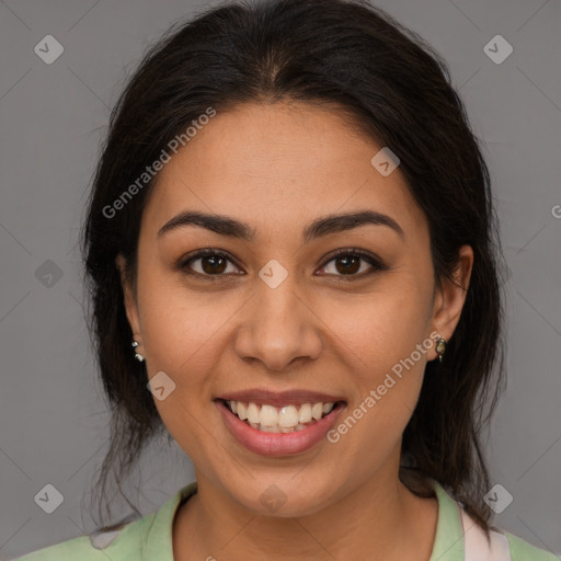 Joyful latino young-adult female with medium  brown hair and brown eyes