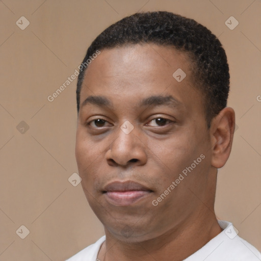 Joyful black young-adult male with short  black hair and brown eyes