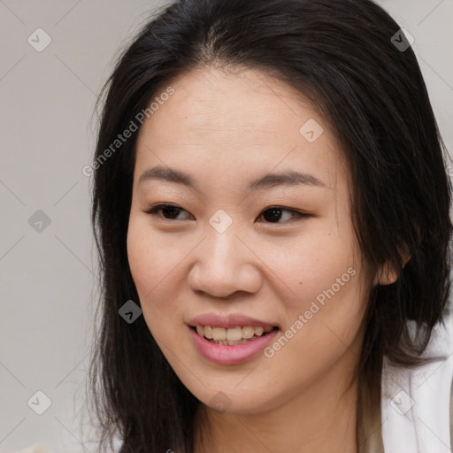 Joyful asian young-adult female with long  brown hair and brown eyes