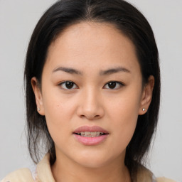 Joyful asian young-adult female with medium  brown hair and brown eyes