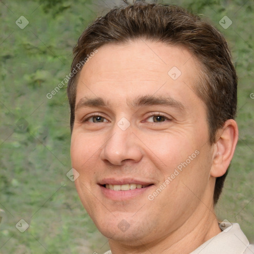 Joyful white adult male with short  brown hair and brown eyes