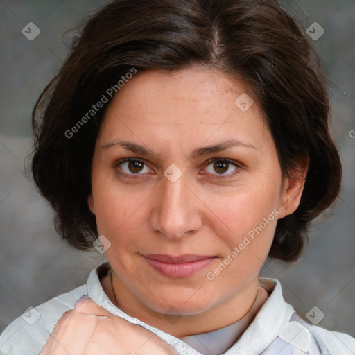 Joyful white adult female with medium  brown hair and brown eyes