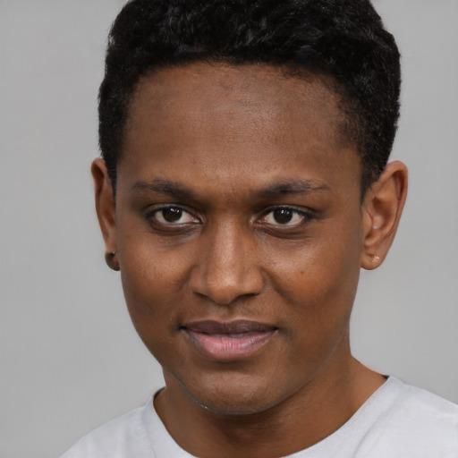 Joyful black young-adult male with short  black hair and brown eyes