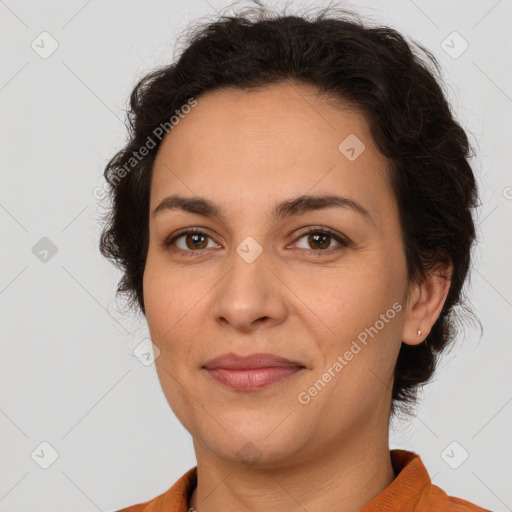 Joyful white adult female with short  brown hair and brown eyes