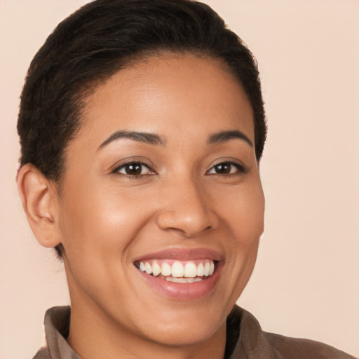 Joyful latino young-adult female with short  brown hair and brown eyes