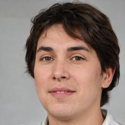 Joyful white young-adult male with medium  brown hair and brown eyes