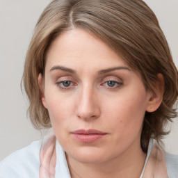 Neutral white young-adult female with medium  brown hair and blue eyes