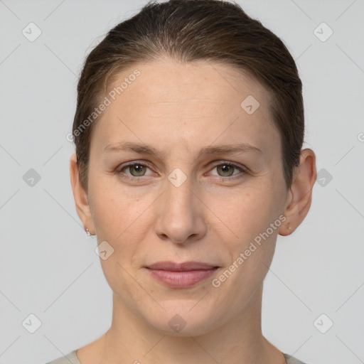 Joyful white adult female with short  brown hair and grey eyes