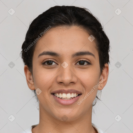 Joyful latino young-adult female with short  brown hair and brown eyes