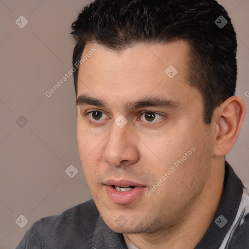 Neutral white young-adult male with short  black hair and brown eyes